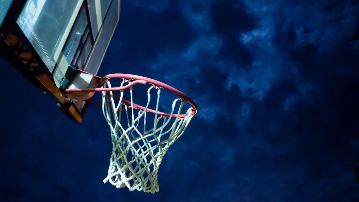 Basketball net against a night sky