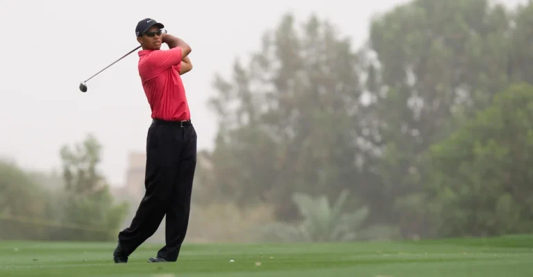 Tiger Woods hits a shot from the fairway.