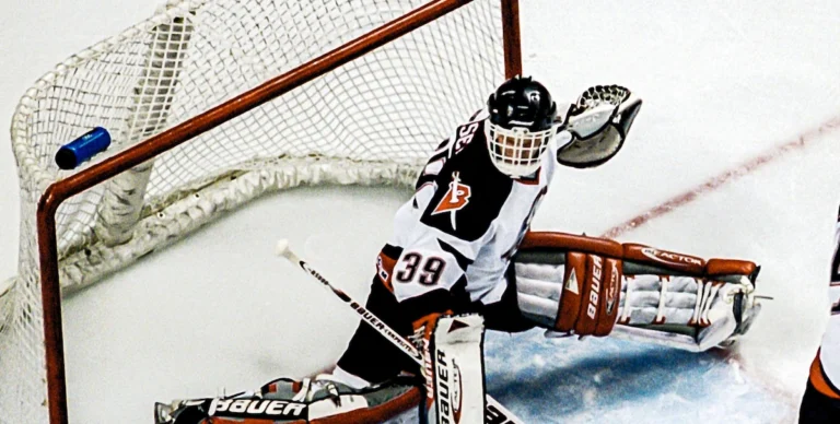 Dominik Hasik saves the puck in an NHL game.