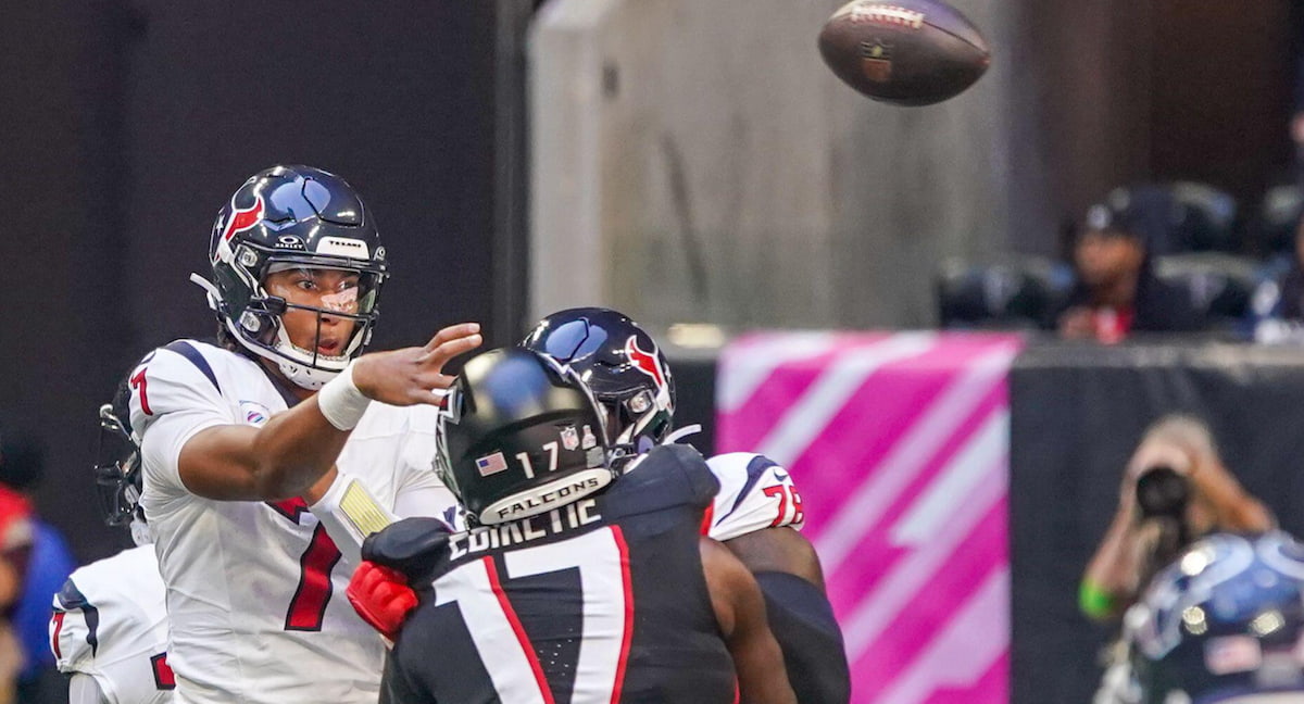 CJ Stroud of the Texans throws a pass against the Atlanta Falcons.