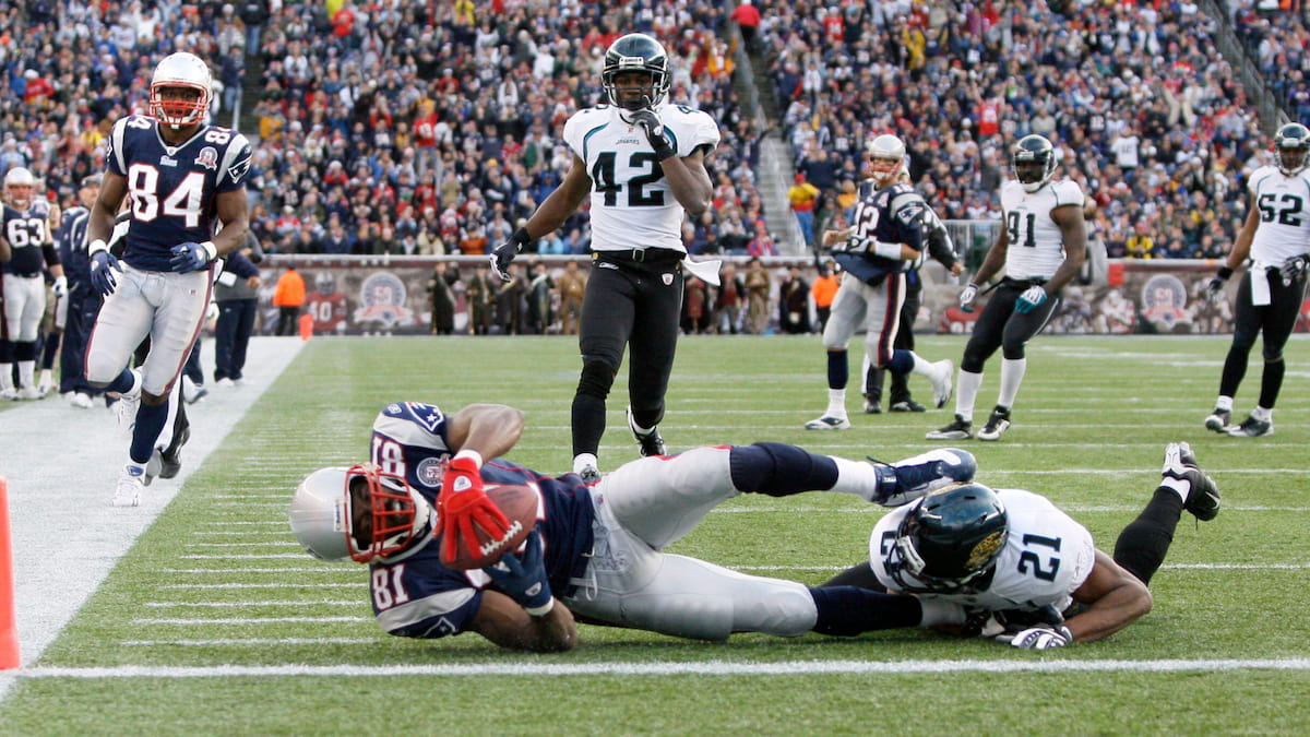 Randy Moss scores a touchdown for the New England Patriots