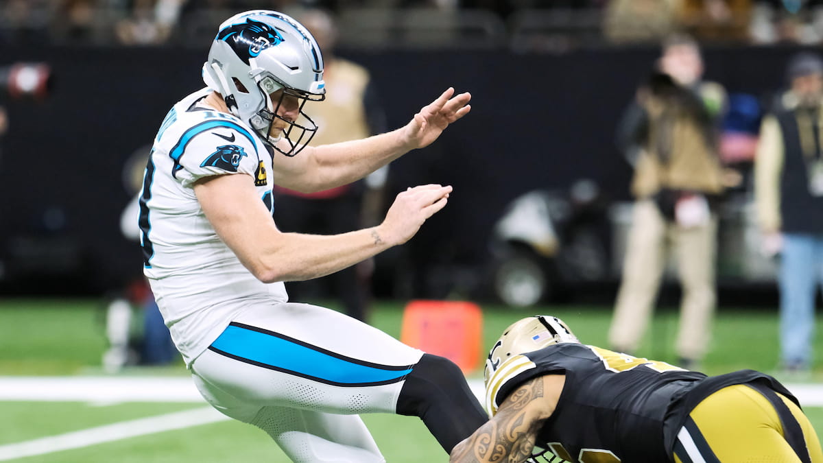 Carolina Panthers punter Johnny Hekker has his kick blocked by New Orleans Saints linebacker Nephi Sewell.