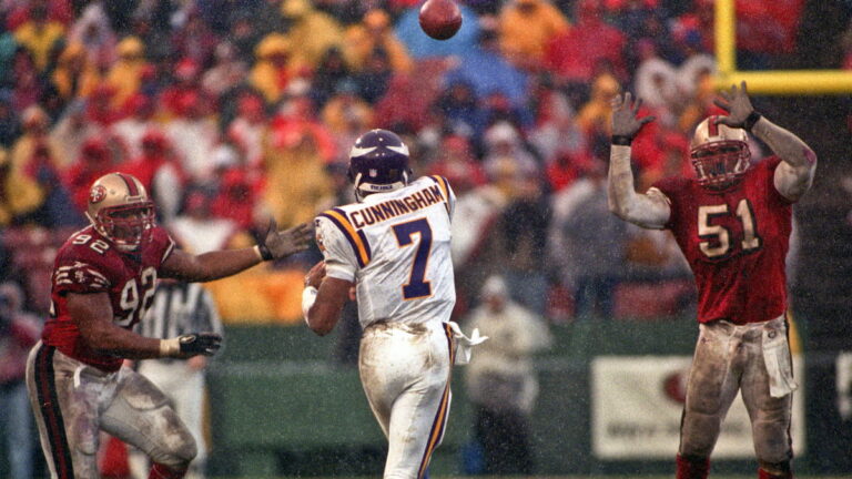 Randall Cunningham throwing for the Vikings in the NFL.