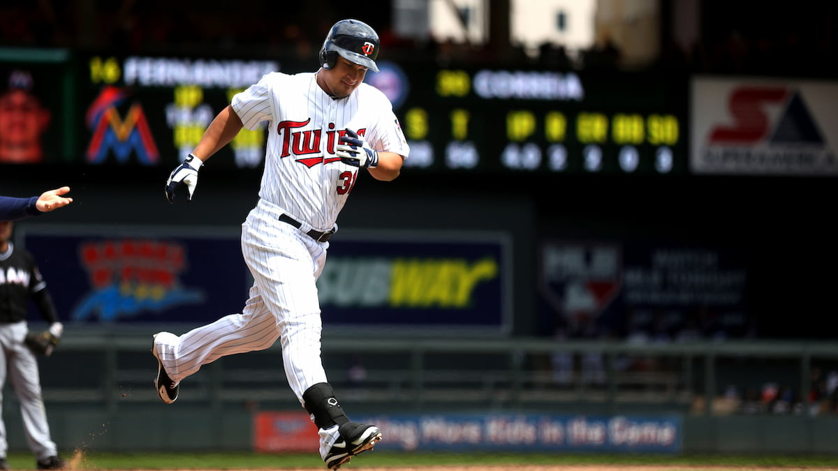 Minnesota Twins batsman rounding the bases after hitting a home run.