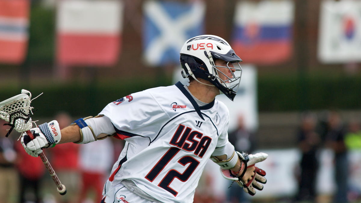 Team USA lacrosse player celebrating a goal.