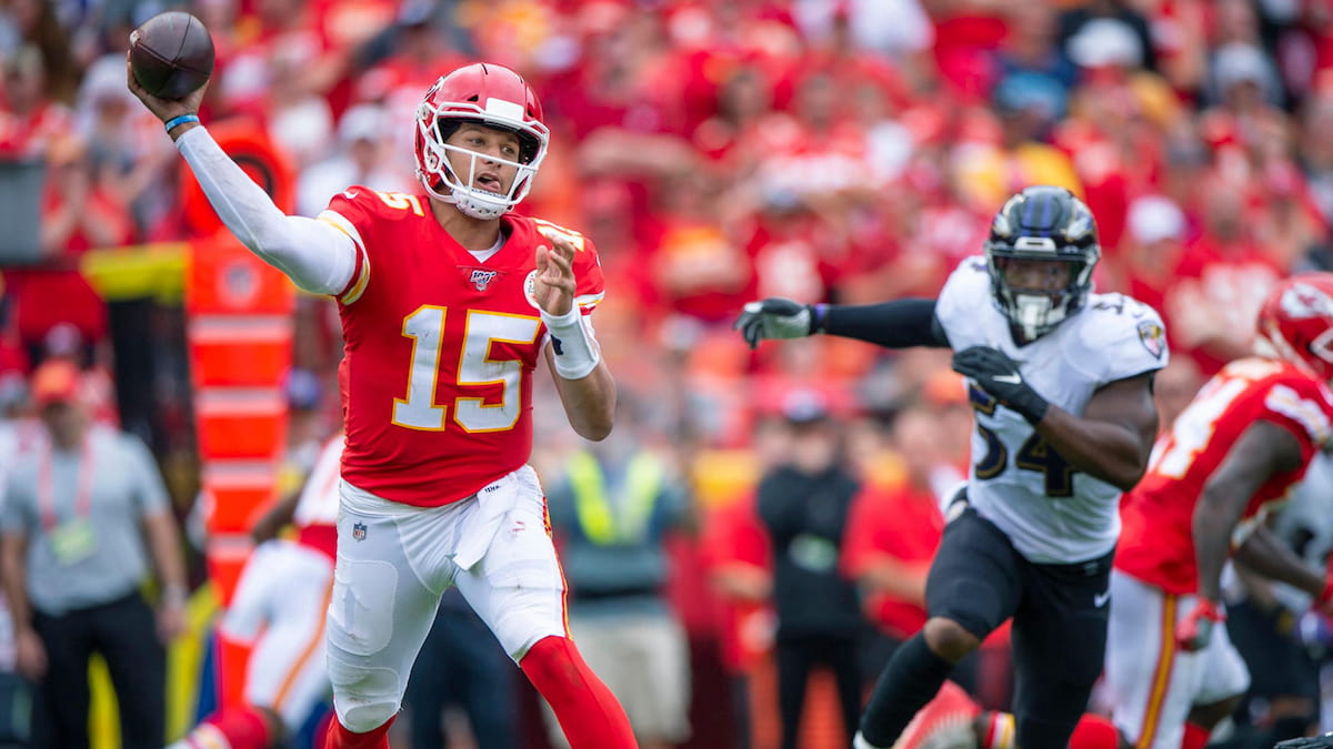 Patrick Mahomes of the Chiefs throwing the ball against the Ravens.