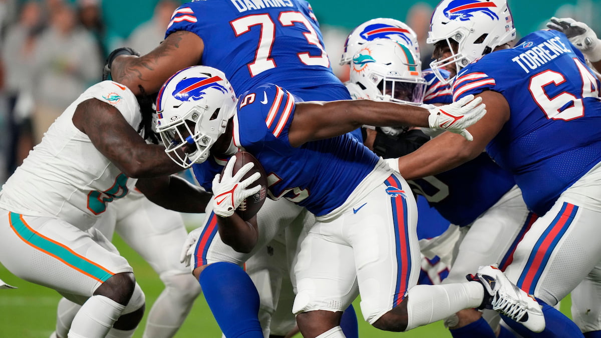 The Buffalo Bills running the ball versus the Miami Dolphins.