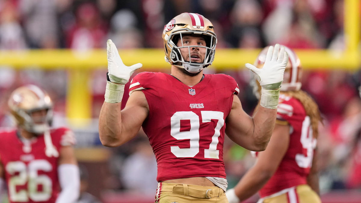 Nick Bosa of the 49ers raises his arms in celebration.