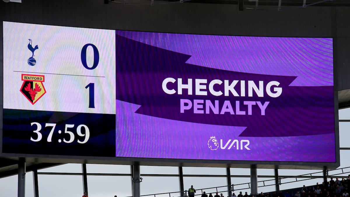 VAR check in progress during a Premier League soccer game.