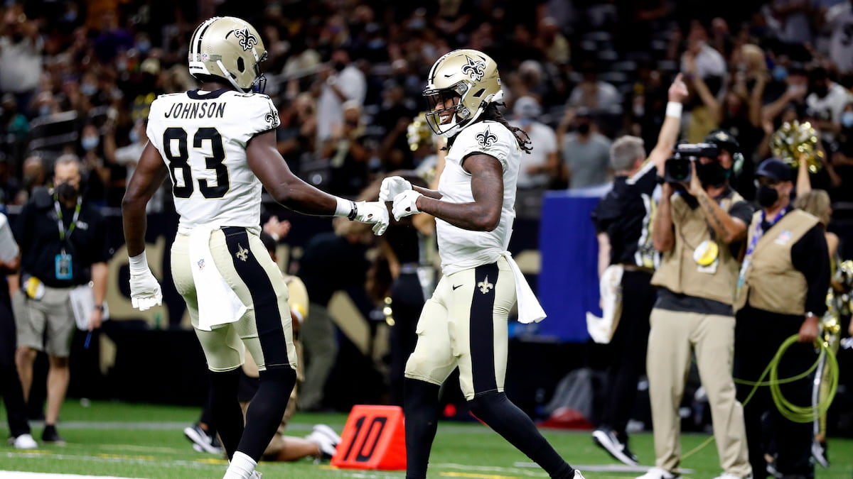 New Orleans Saints players celebrating a score.