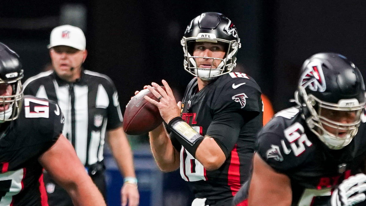 Kirk Cousins holding the ball in the pocket for the Atlanta Falcons.