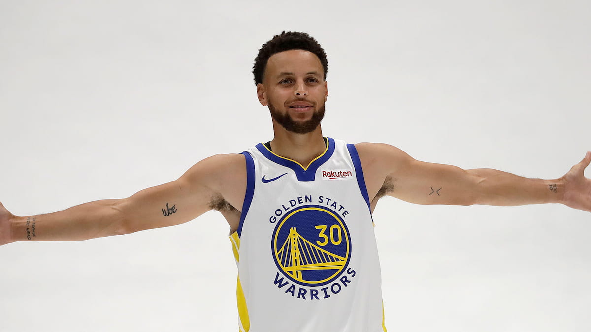Steph Curry of the Golden State Warriors with arms outstretched.