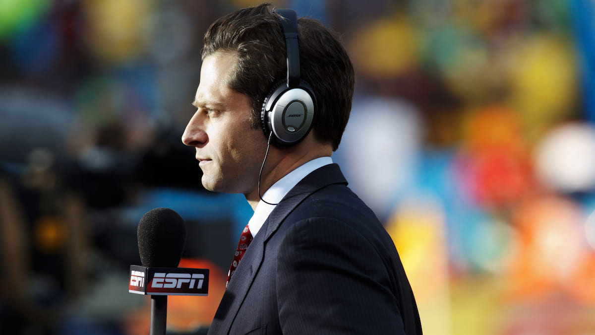 ESPN sports reporter preparing to broadcast.