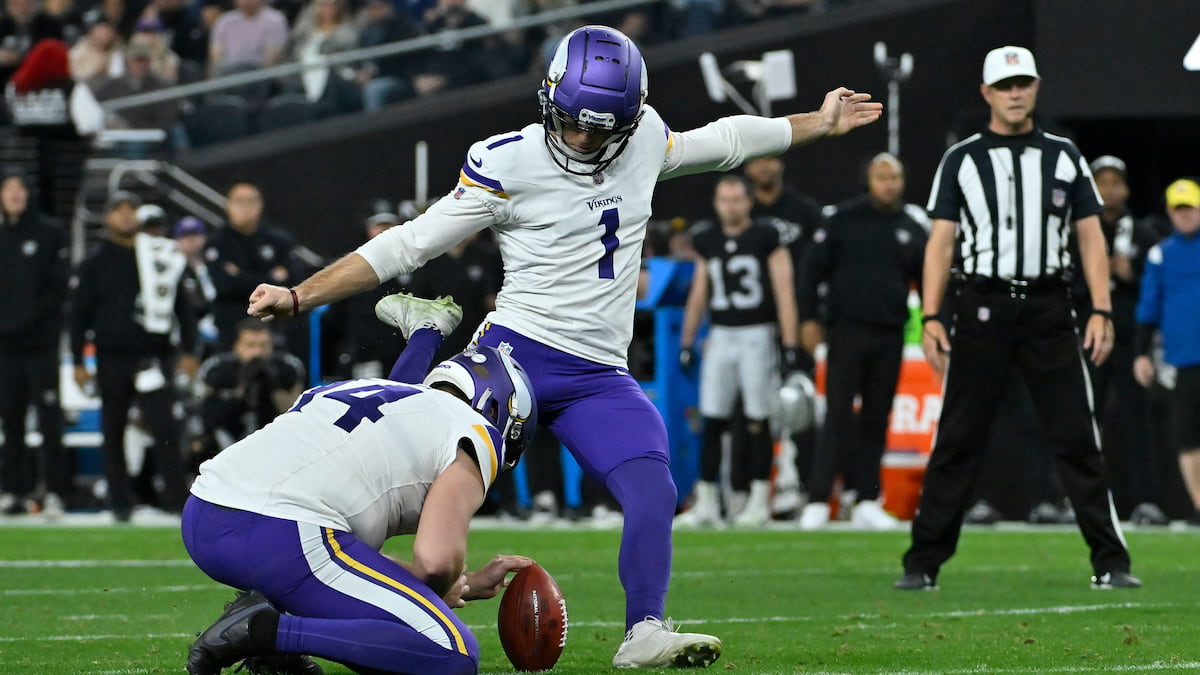 Minnesota Vikings kicker Greg Joseph (1) kicks a field goal against the Raiders in a low-scoring NFL game.