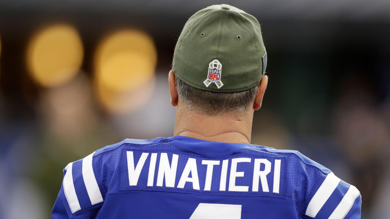 Adam Vinatieri prior to an NFL game, wearing a Colts shirt.