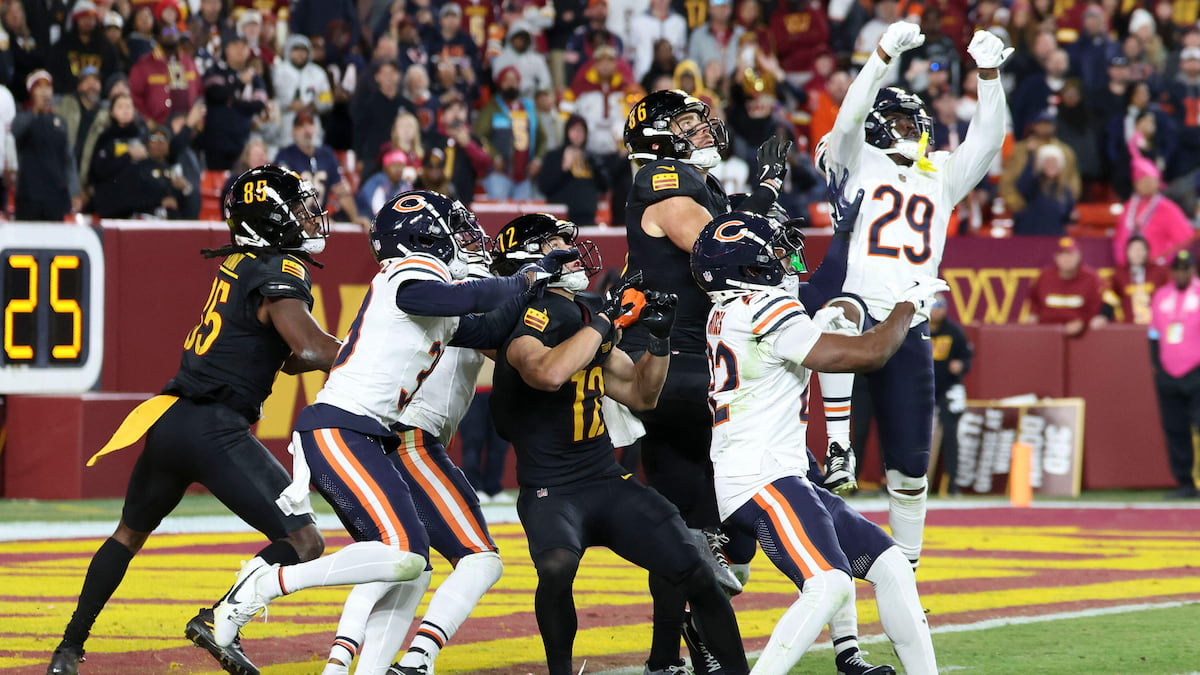 Players from the Bears and Commanders attempt to catch a Hail Mary pass from Jayden Daniels.