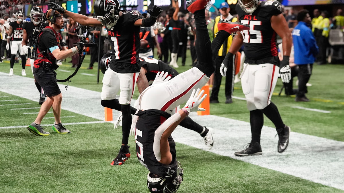 Atlanta Falcons players celebrating a touchdown against the Cowboys.