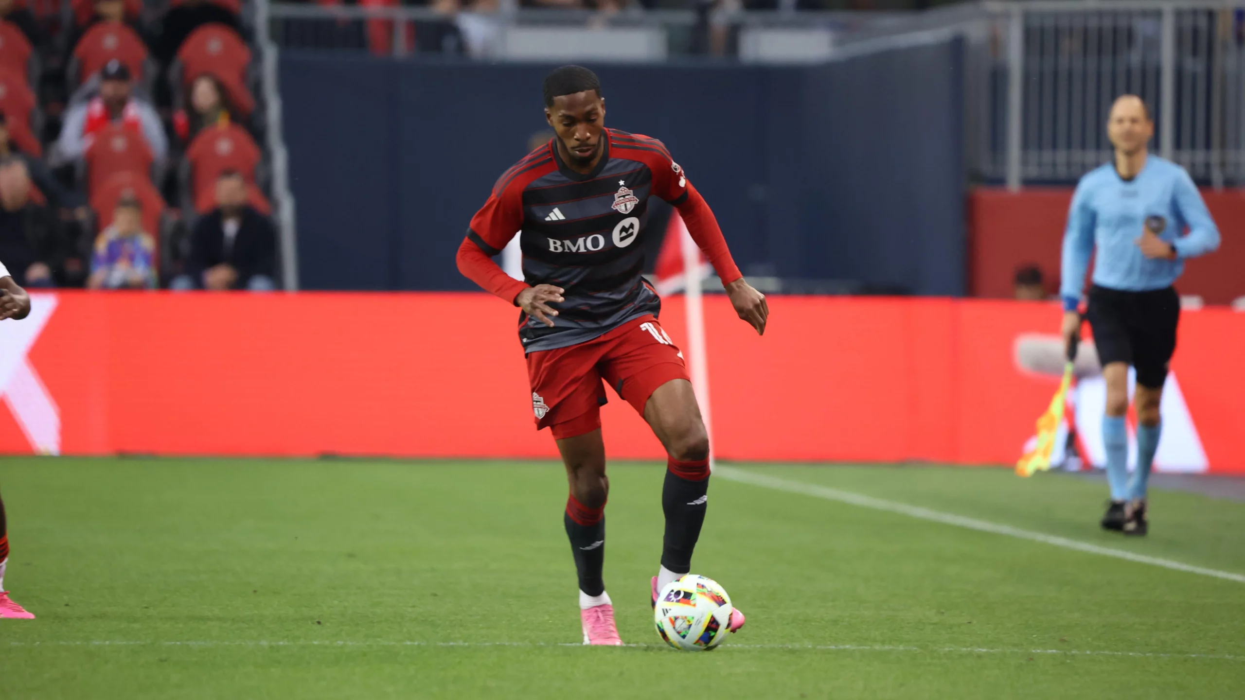 Tyrese Spicer carries the ball for Toronto FC after being selected first overall in the 2024 MLS SuperDraft.