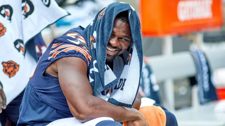 Khalil Mack of the Chicago Bears laughing on the sidelines during an NFL game.