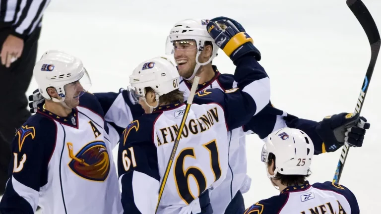 Atlanta Thrashers hockey players celebrate scoring a goal