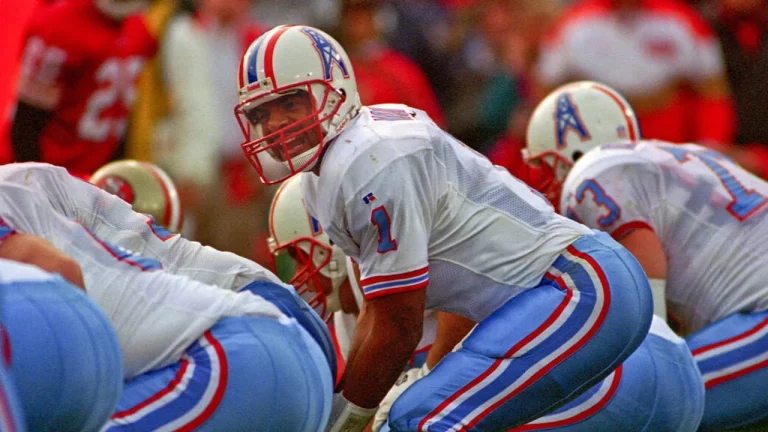 Houston Oilers QB Warren Moon taking a snap.