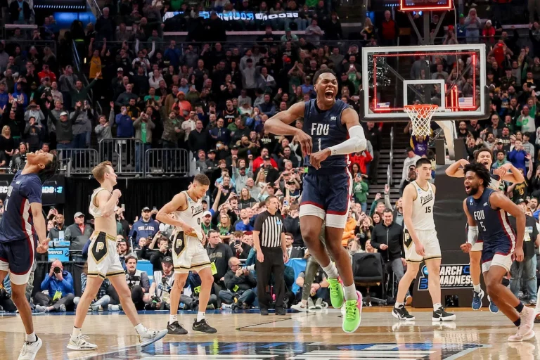 Fairleigh Dickinson players celebrate pulling off one of the biggest NCAA Tournament upsets ever after beating Purdue in 2023.