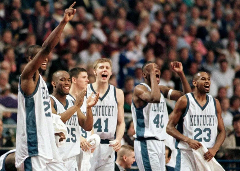 The Kentucky Wildcats celebrate winning the 1996 NCAA Tournament after beating Syracuse in the championship game.