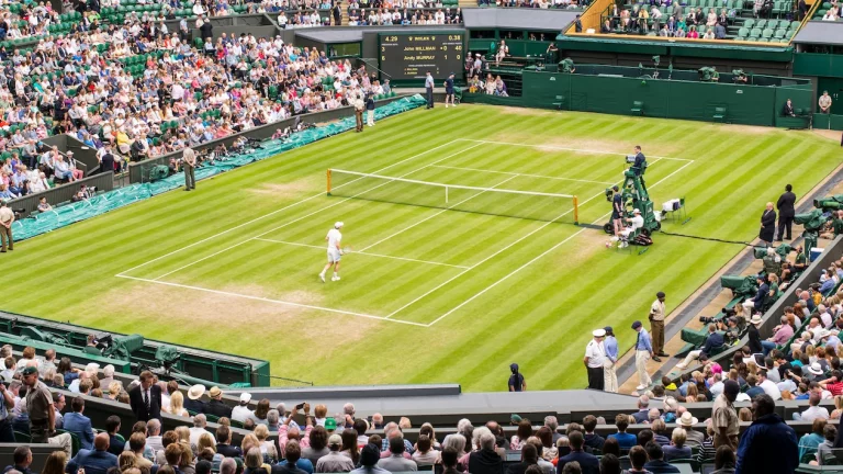 Two players competing at Wimbledon Centre Court.