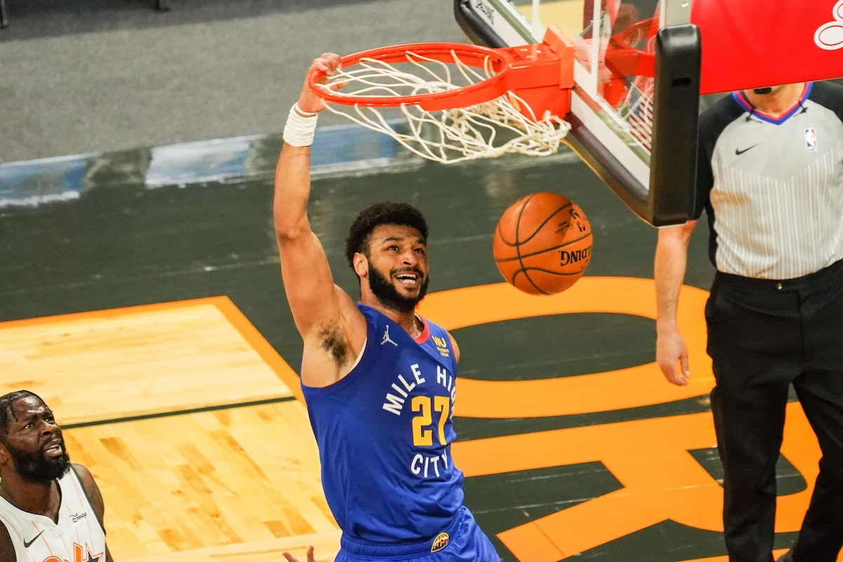 Jamal Murray dunks the ball while playing for the Denver Nuggets against the Orlando Magic in the NBA.