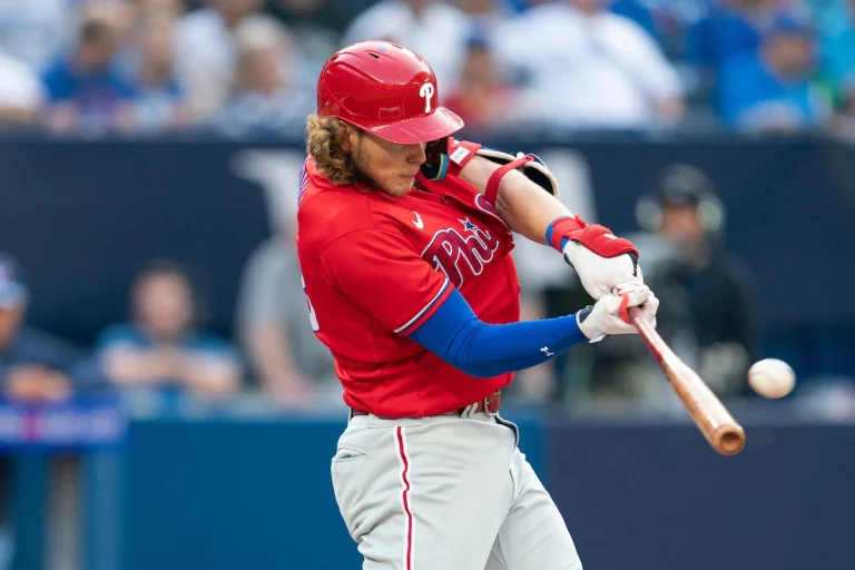 The Philadelphia Phillies' Alec Bohm connects with the ball for a home run against the Toronto Blue Jays.