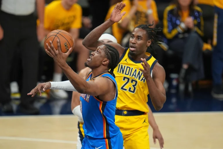 Oklahoma City Thunder forward Jalen Williams shoots past Indiana Pacers forward Aaron Nesmith (23) during the first half of Game 6 of the NBA Finals basketball series, Thursday, June 19, 2025, in Indianapolis.